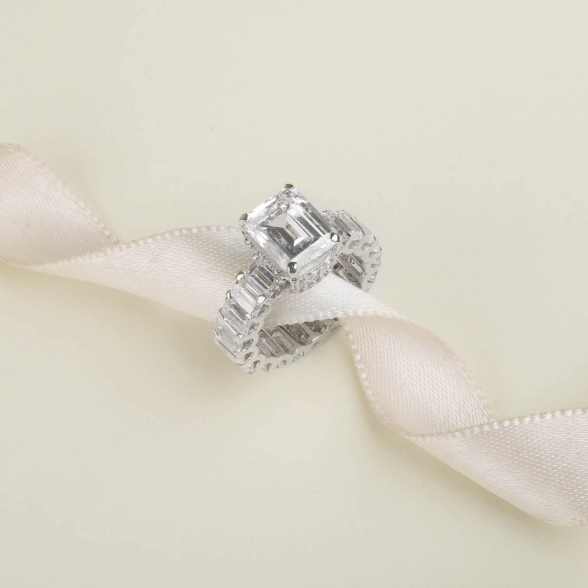Emerald Shaped Solitaire With Emerald Band
