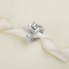 Emerald Shaped Solitaire With Emerald Band
