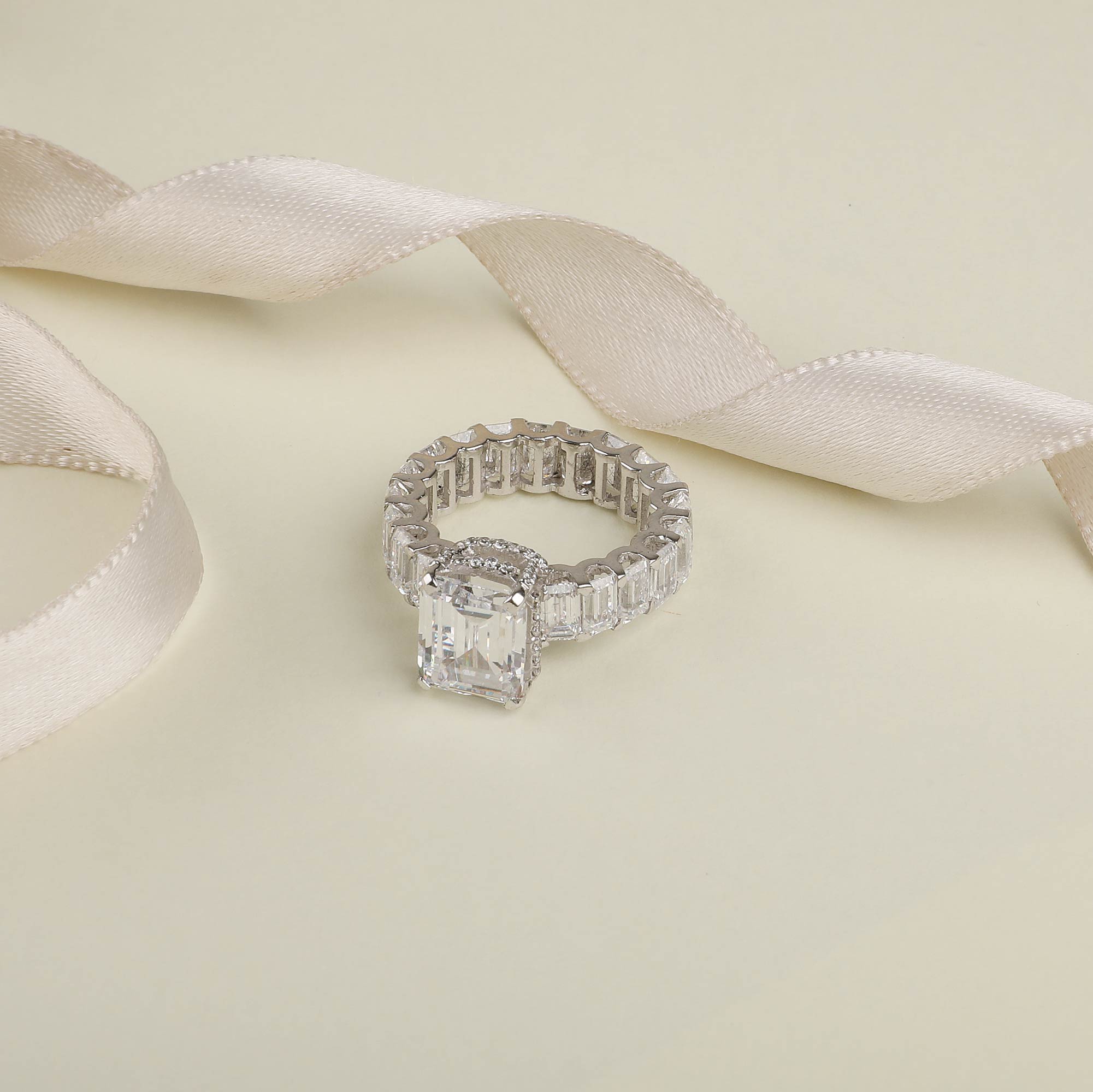 Emerald Shaped Solitaire With Emerald Band